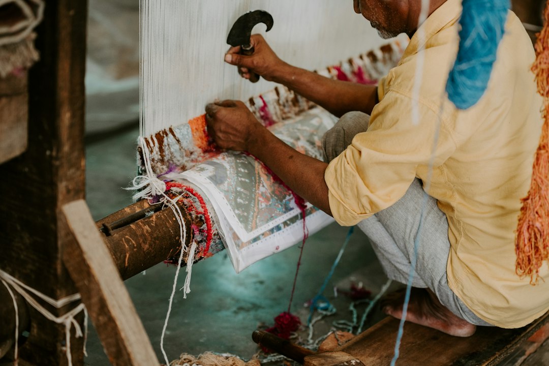 Artisan preparing loom warp