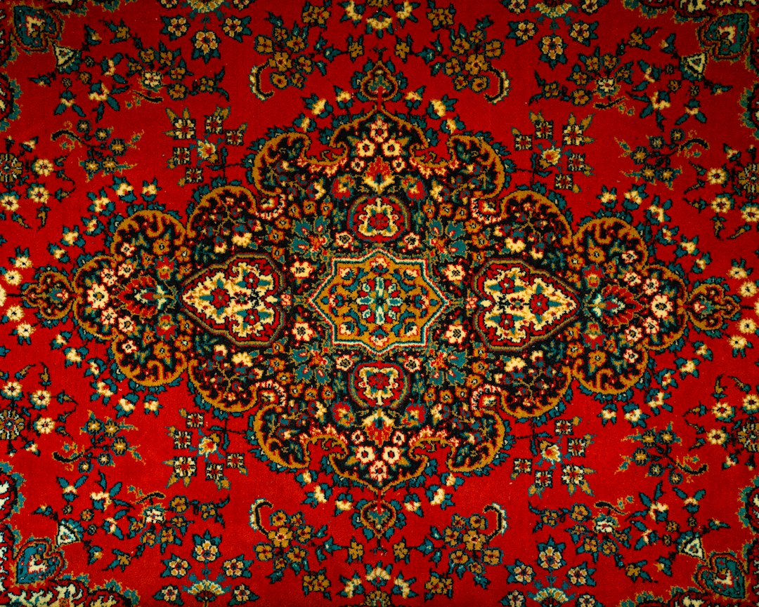 Detailed oriental handwoven rug with rich crimson motifs